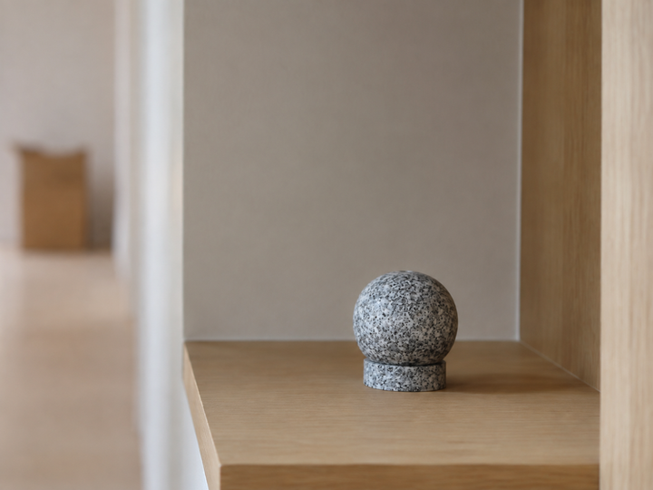 Makabe Stone Incense Stone given a permanent uncluttered place on a shelf in a newly settled home.