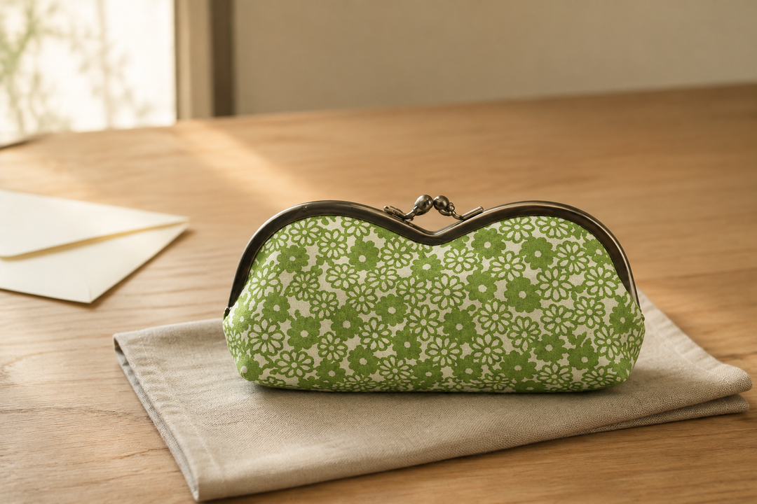 A single yellow-green Tokyo Some-Komon eyeglass case presented as a craft gift on a simple indoor table.