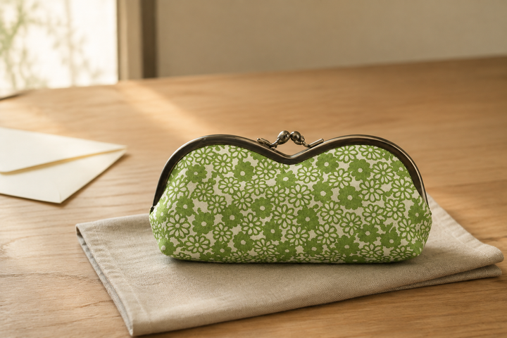 A single yellow-green Tokyo Some-Komon eyeglass case presented as a craft gift on a simple indoor table.