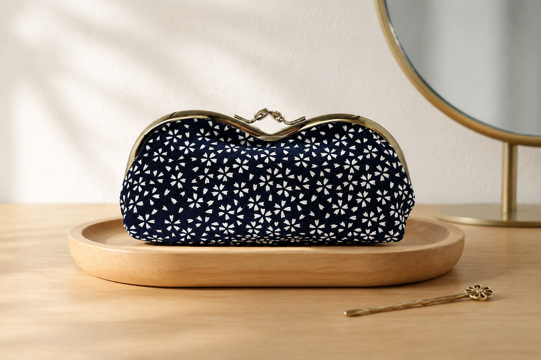 Navy Tokyo Some-Komon eyeglass case arranged on an indoor dressing table in morning light.
