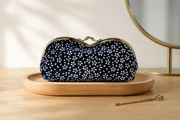 Navy Tokyo Some-Komon eyeglass case arranged on an indoor dressing table in morning light.