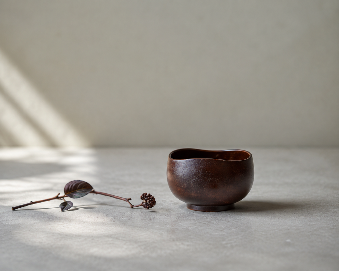 Bud: Lilac lacquerware vessel with one restrained flower stem placed nearby.