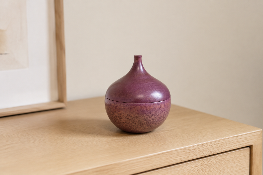 Bulb: Lilac standing closed as a quiet sculptural accent on a contemporary shelf.