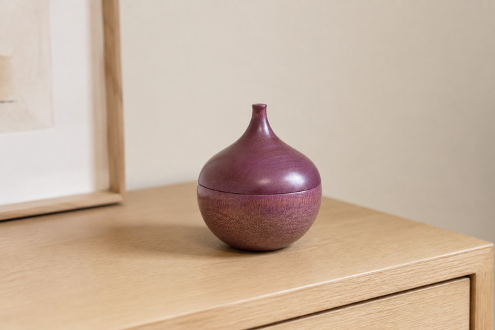 Bulb: Lilac standing closed as a quiet sculptural accent on a contemporary shelf.