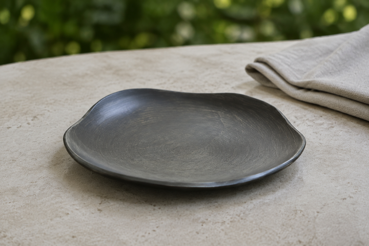 Empty RIN 5.0 Sesame plate on a stable shaded outdoor table