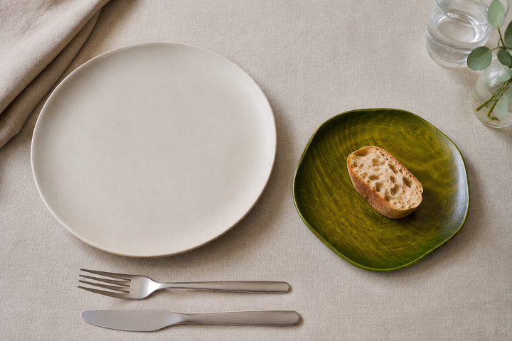RIN 5.0 Olive used as a compact side plate beside a larger neutral dinner plate.