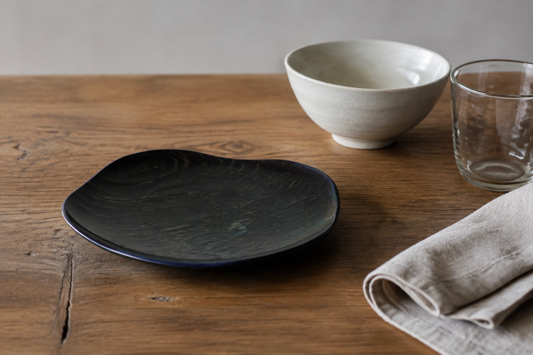 RIN 5.0 Hyacinth anchoring a mixed table setting of pale ceramic, clear glass, and natural linen.