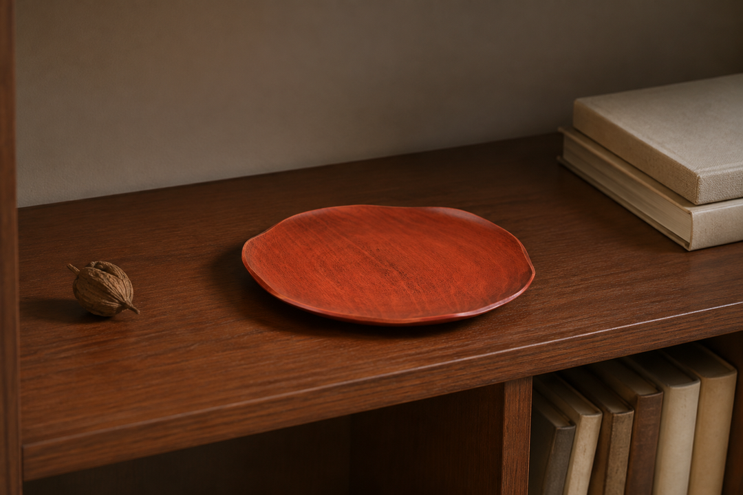 Empty berry-red RIN 7.0 lacquerware plate displayed safely on an interior shelf away from direct sunlight.