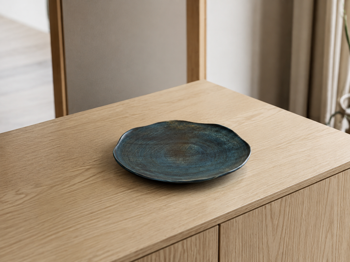 The empty RIN 7.0 Hyacinth displayed on an indoor sideboard with its irregular outline visible from above.