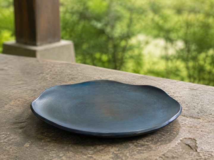 The empty RIN 7.0 Hyacinth on a stable outdoor table in open shade.