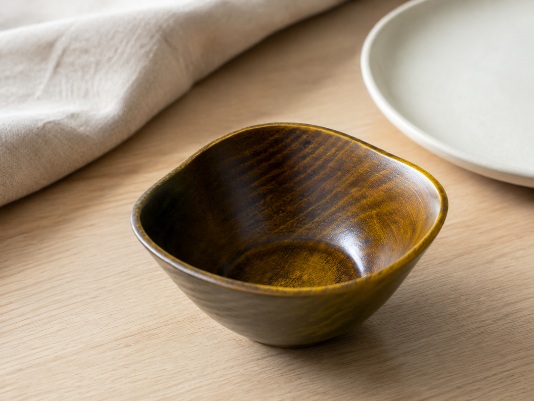 RIN Bowl S Mimosa set empty at an individual dining place on a pale wood table.