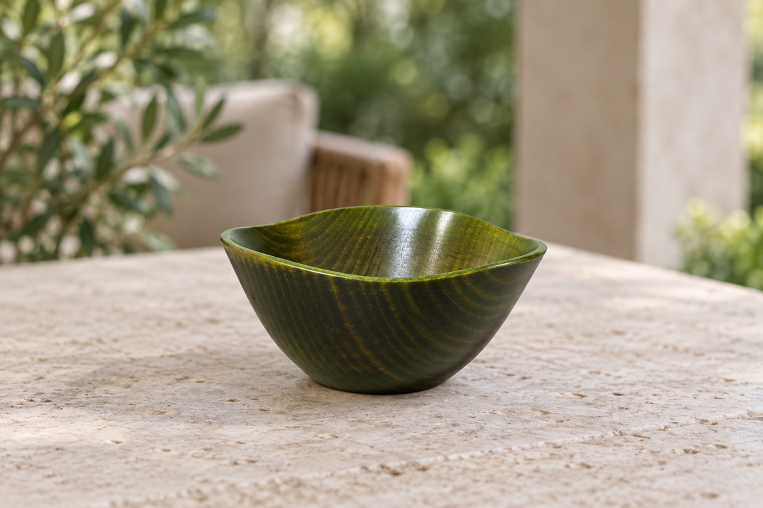 Empty RIN Bowl S Olive on a stable shaded outdoor table for a temporary supervised setting.