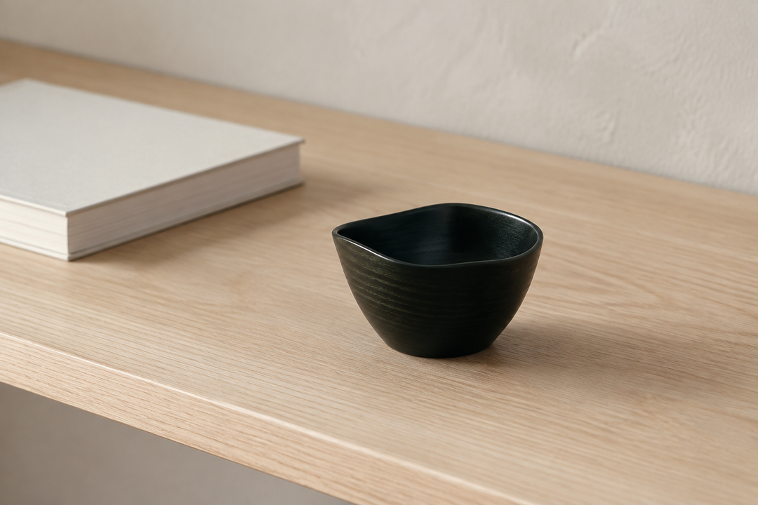 Empty RIN Bowl S Hyacinth viewed slightly from above on a quiet indoor shelf between uses.