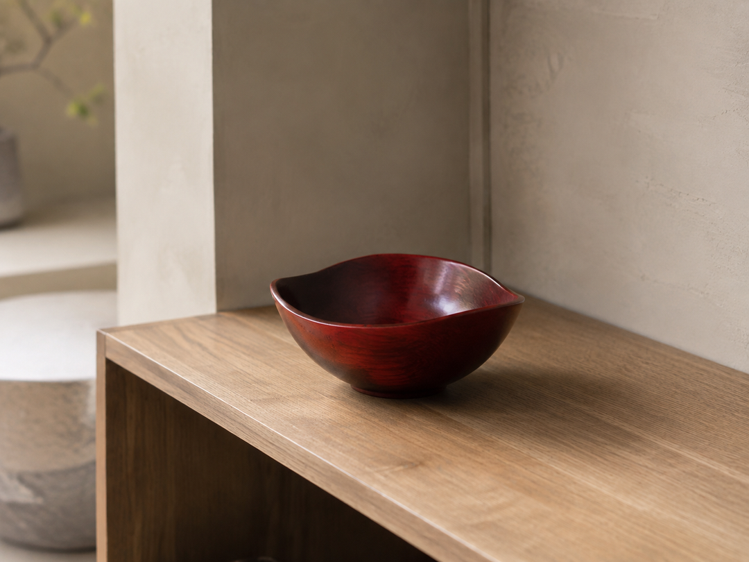 Empty RIN Bowl M Berry displayed indoors as a small sculptural accent on an open shelf.