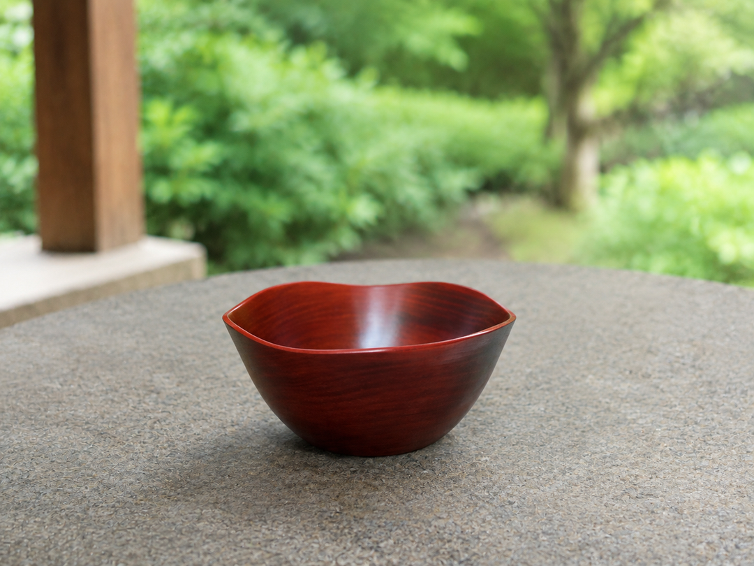 Empty RIN Bowl M Berry on a stable dry outdoor table in full shade beneath a covered veranda.