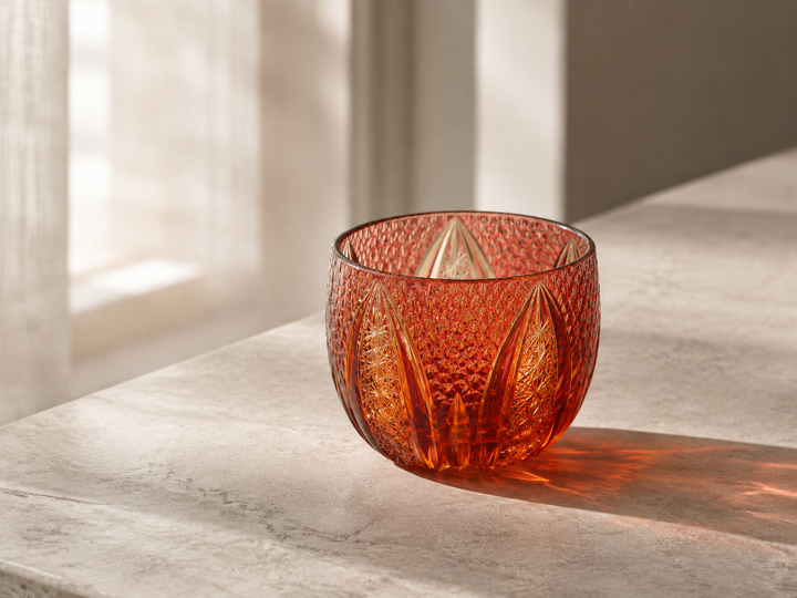 GENEN Gold-Red and Amber Edo Kiriko glass in soft side light on a pale stone surface.