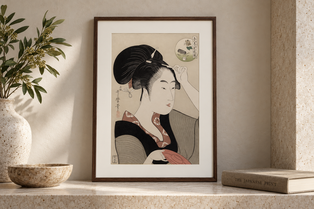 The framed Suminoe from Shiba print displayed in a pale stone recess beside a bowl, books, and a vase.