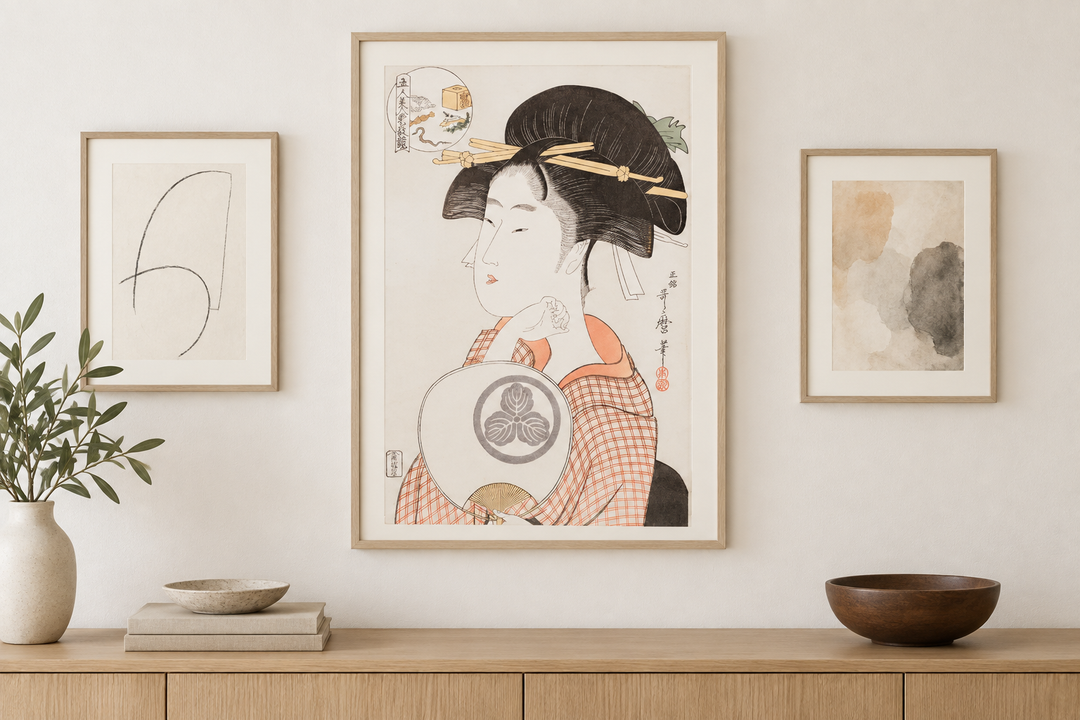 The Utamaro portrait anchoring a restrained arrangement with two subtle works on paper.