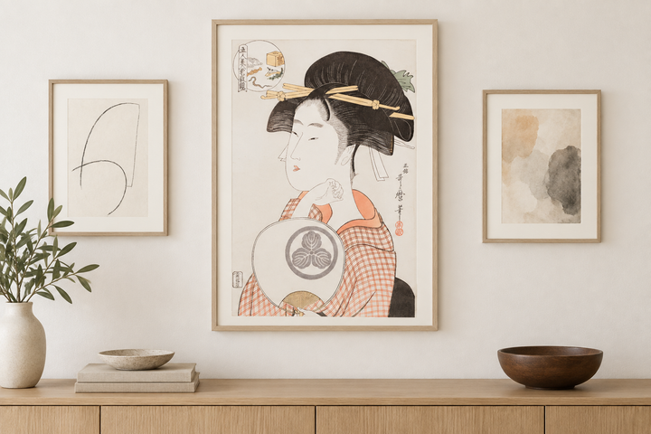 The Utamaro portrait anchoring a restrained arrangement with two subtle works on paper.