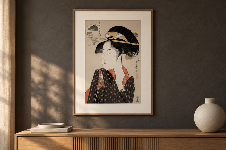 The matted Utamaro portrait paired with natural wood, dark plaster and linen in a contemporary living interior.